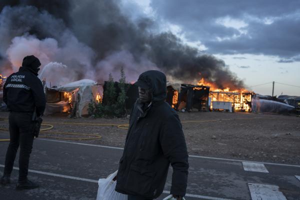 200 people evacuated as fire engulfs migrant camp in Spain -   
