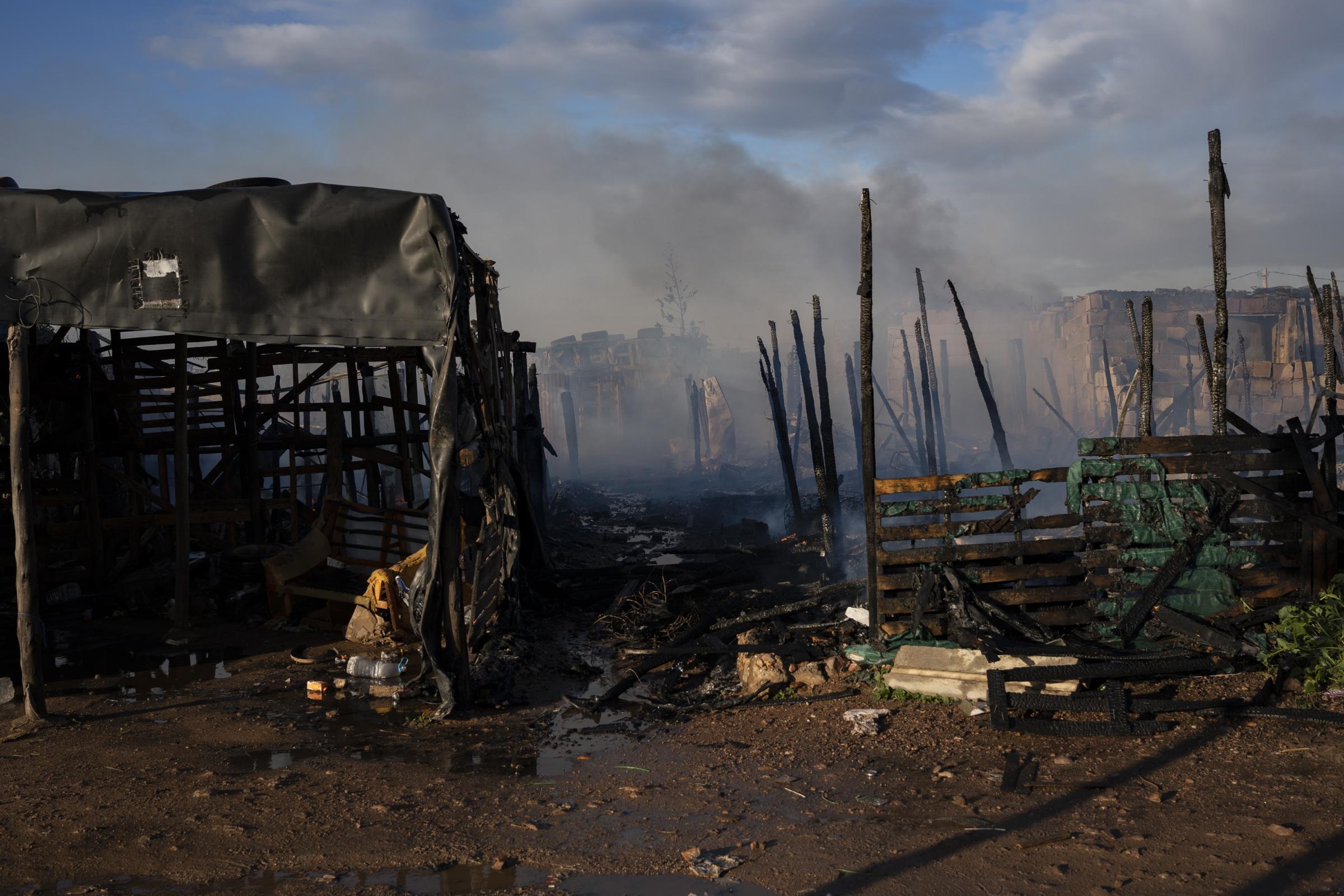 200 people evacuated as fire engulfs migrant camp in Spain