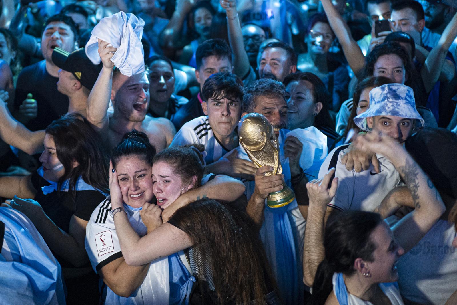 Daily News - Argentina fans celebrate in a discotheque in Barcelona,...