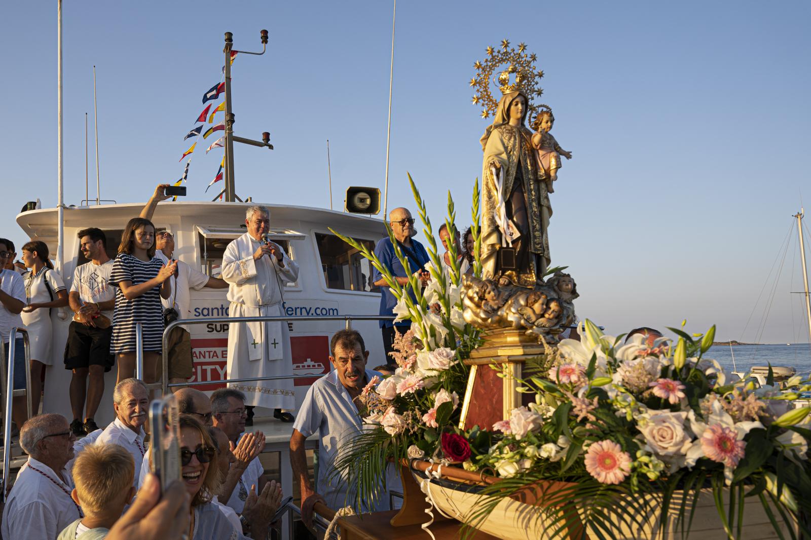 Daily News - Pilgrims on their way to Santa Eulària's port...