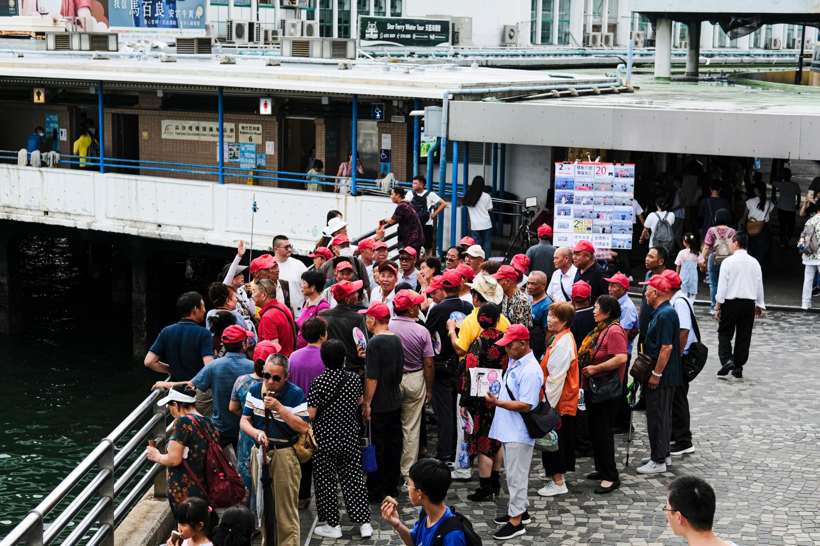 Mainland Chinese tourists gathe...ar Ferry pier in Tsim Sha Tsui.