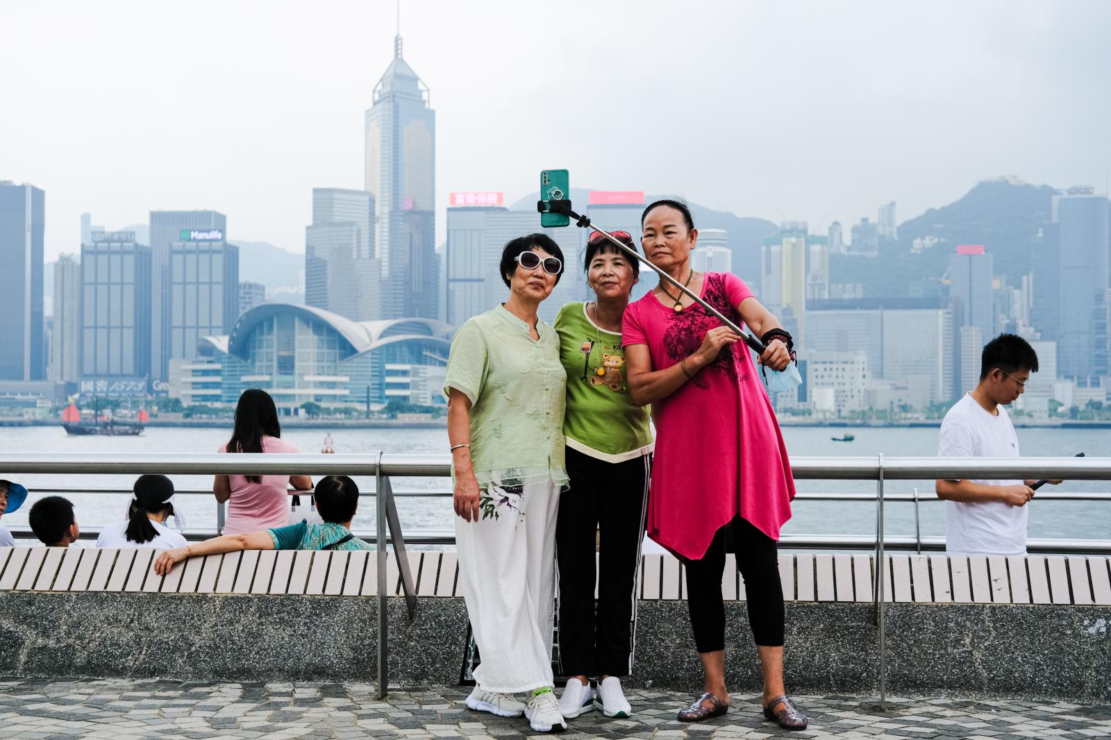 Mainland Chinese tourists take ...ar Ferry pier in Tsim Sha Tsui.