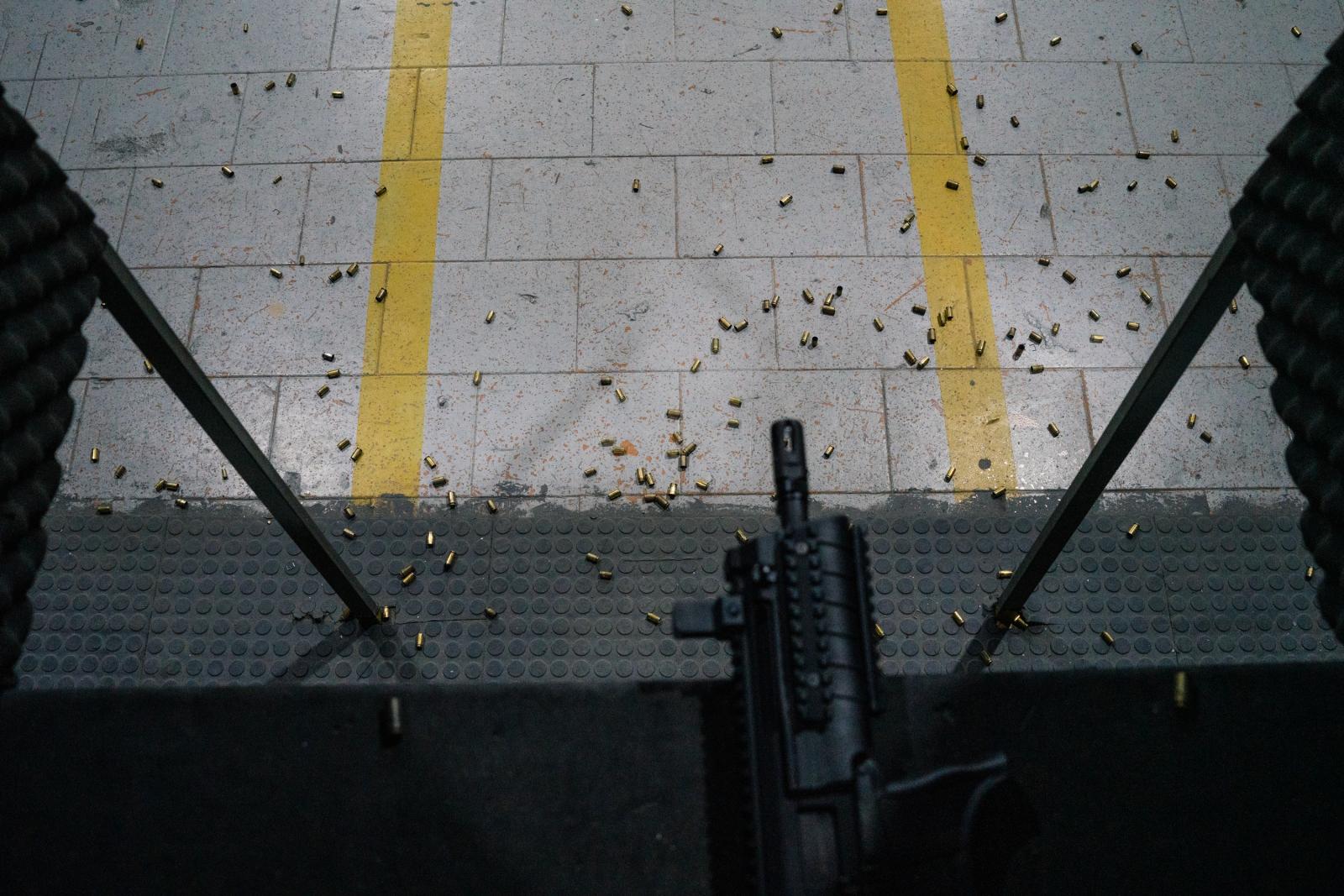 Bullet casings are seen on the ...t 25, 2022. Photo: Ian Cheibub 