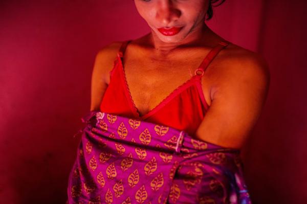 Image from Woman in a Male Body -  Putuli, a transgender woman, changes her dresses to join...