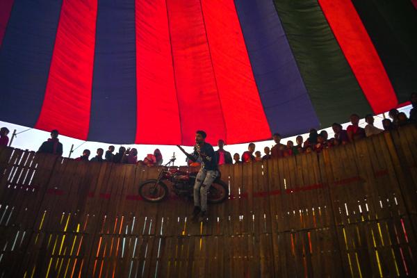 Image from Traditional Circus of Bangladesh -   A stunt motorcyclist performs in the well of death at a...
