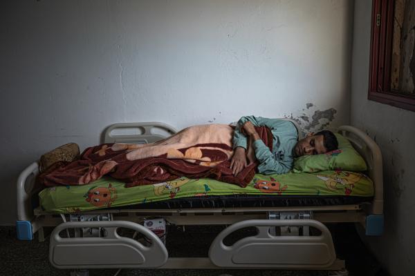 Gaza's Injured Struggle To Recover Six Months After Ceasefire - GAZA CITY, GAZA - DECEMBER 04: Ismael Abu Ryala, 26, is seen sleeping in his house in Al Shati...