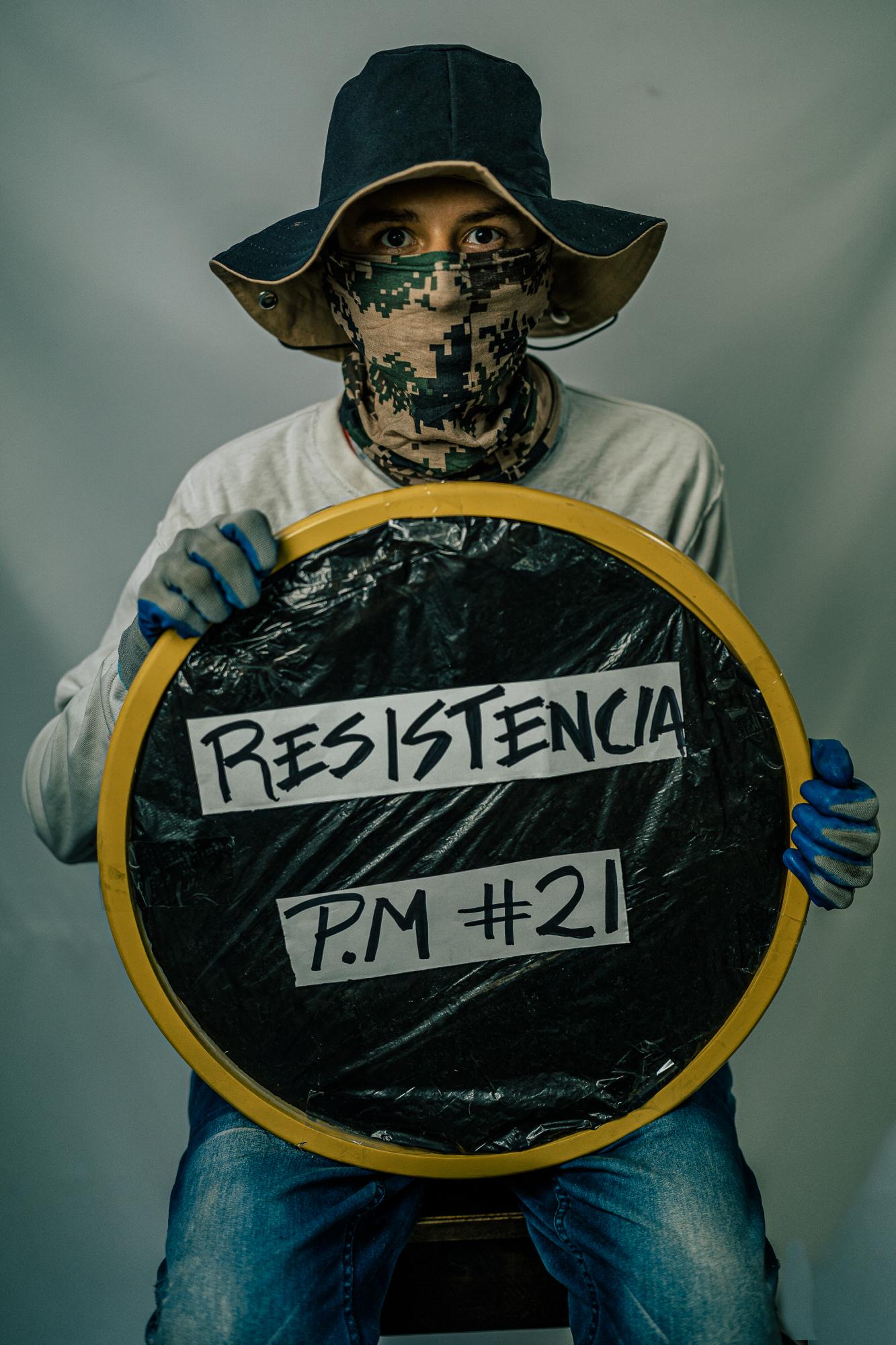 The Washington Post: Resistencia  - José poses with his shield used in protests in Cali, Colombia.  While keeping guard at a...