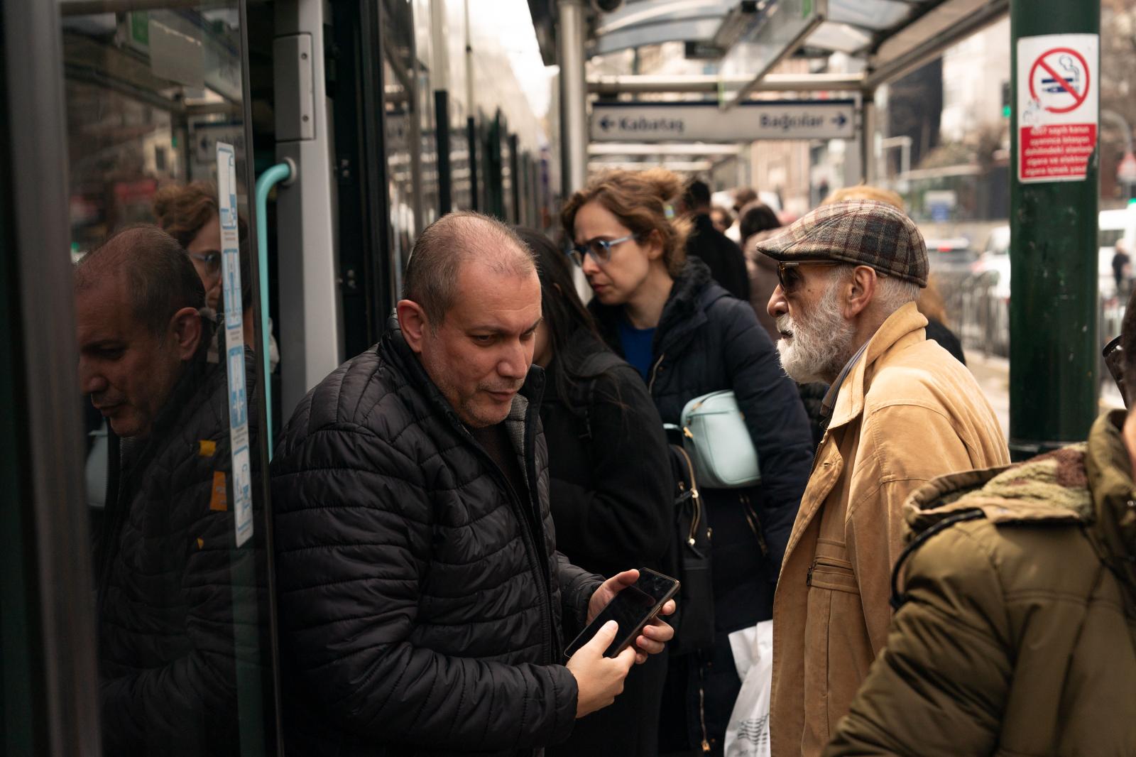 Residents enter and exit the tram in Istanbul, Turkey.