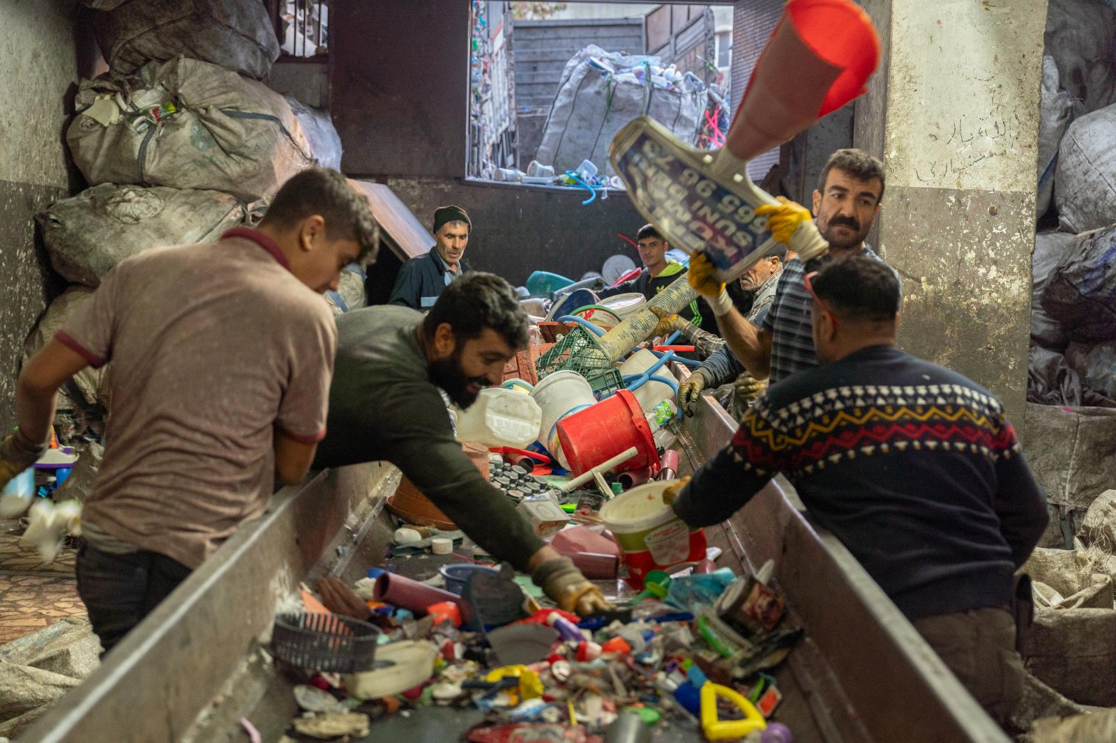 Workers organize shipments of r...ing center in Istanbul, Turkey.