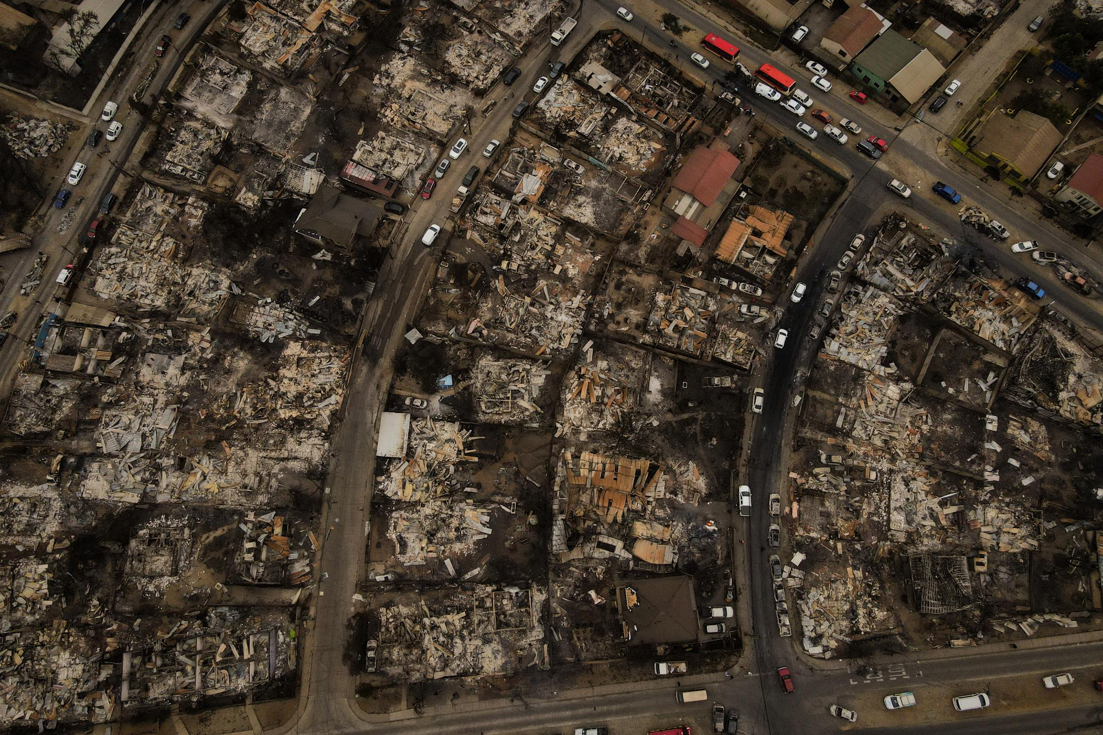 The remains of burned houses fo..., 2024. REUTERS/ Sofia Yanjari 