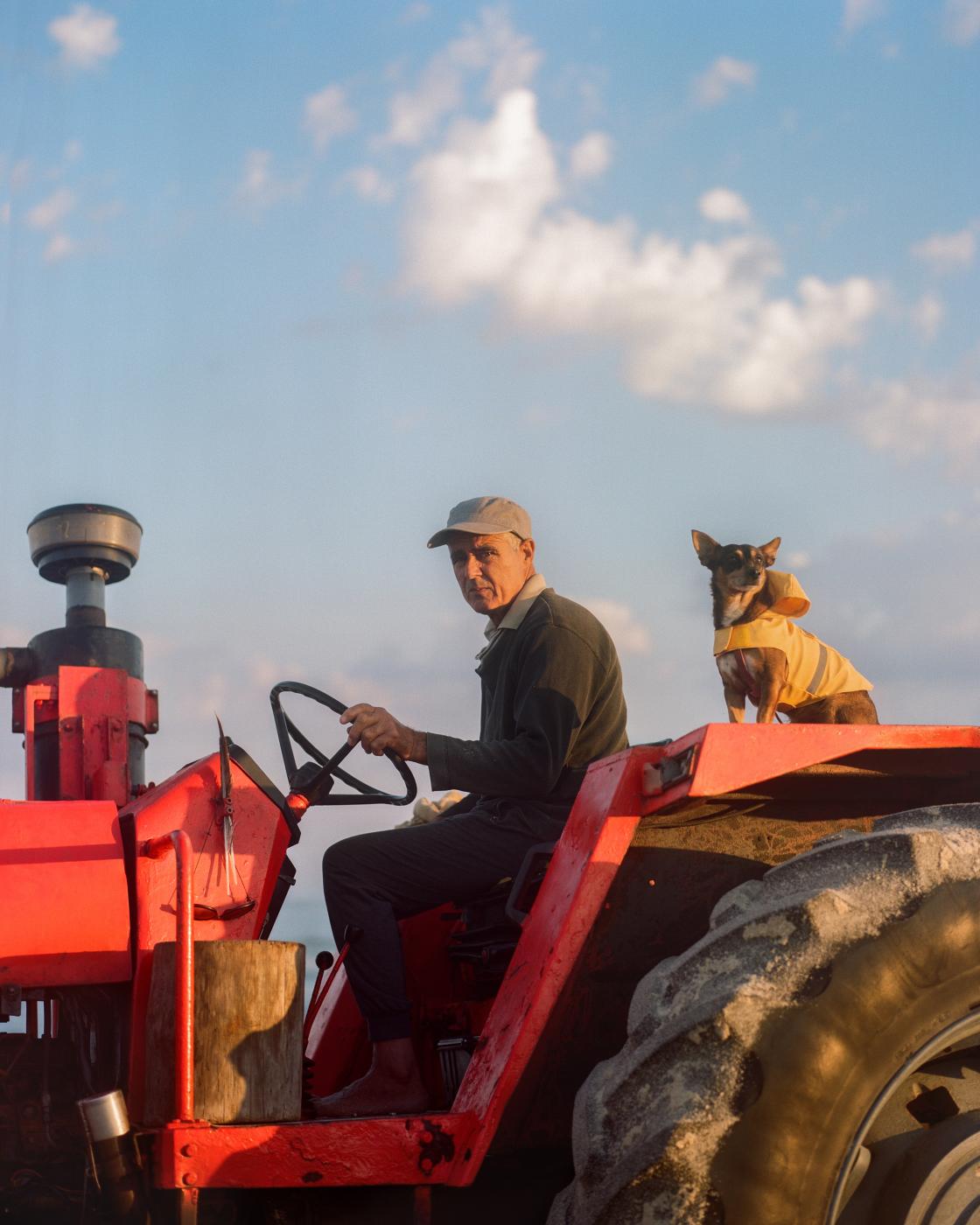 Paolo and is dog on a tractor t...lturel. Praia da Tocha PORTUGAL
