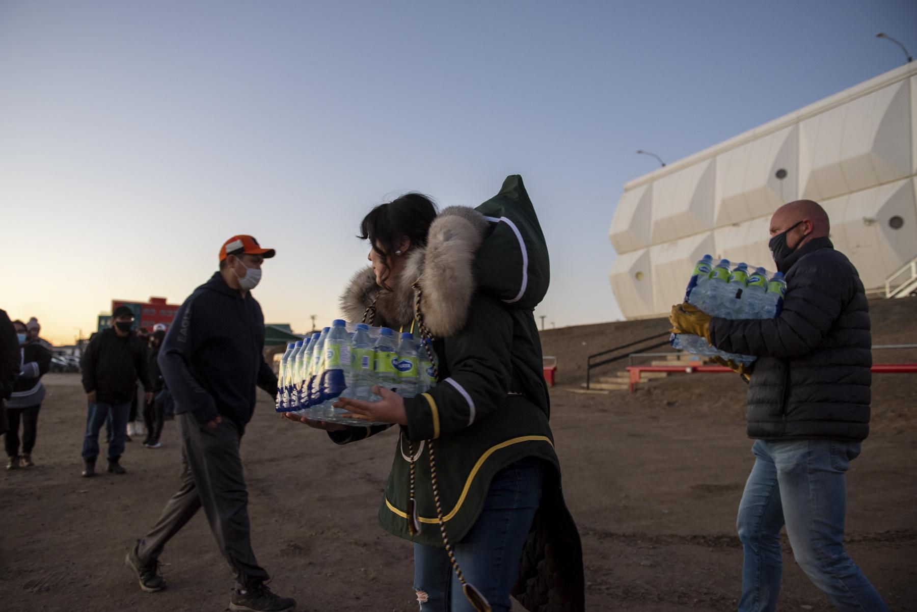 No Place to Grow Old - The Globe and Mail - Iqaluit residents pick up bottled water donated by the...
