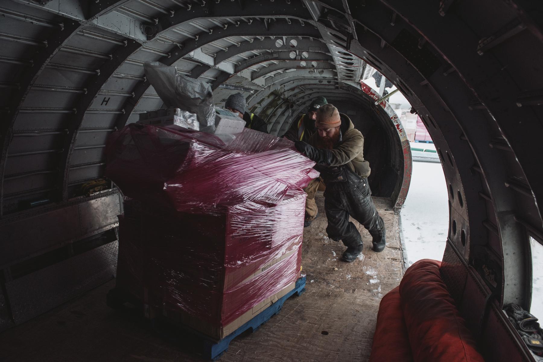 The Hunt for Healthy Food - Workers load food into the fuselage of a Buffalo Airways...
