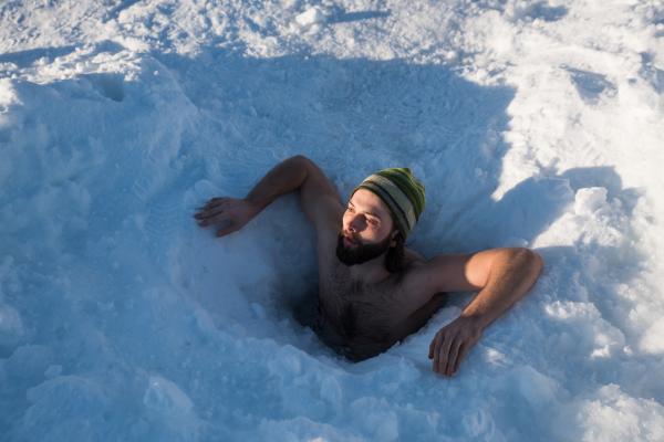 Image from Portraits - Shad McLeod does a “polar dip” in an ice hole on...