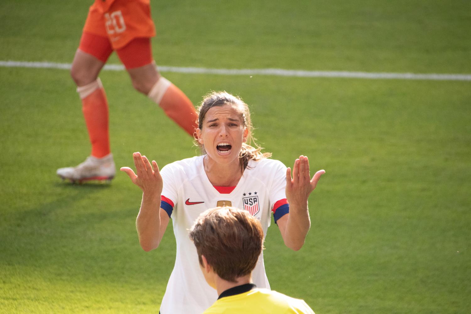 Sports - Tobin Heath challenges the referee on a call at the 2019...