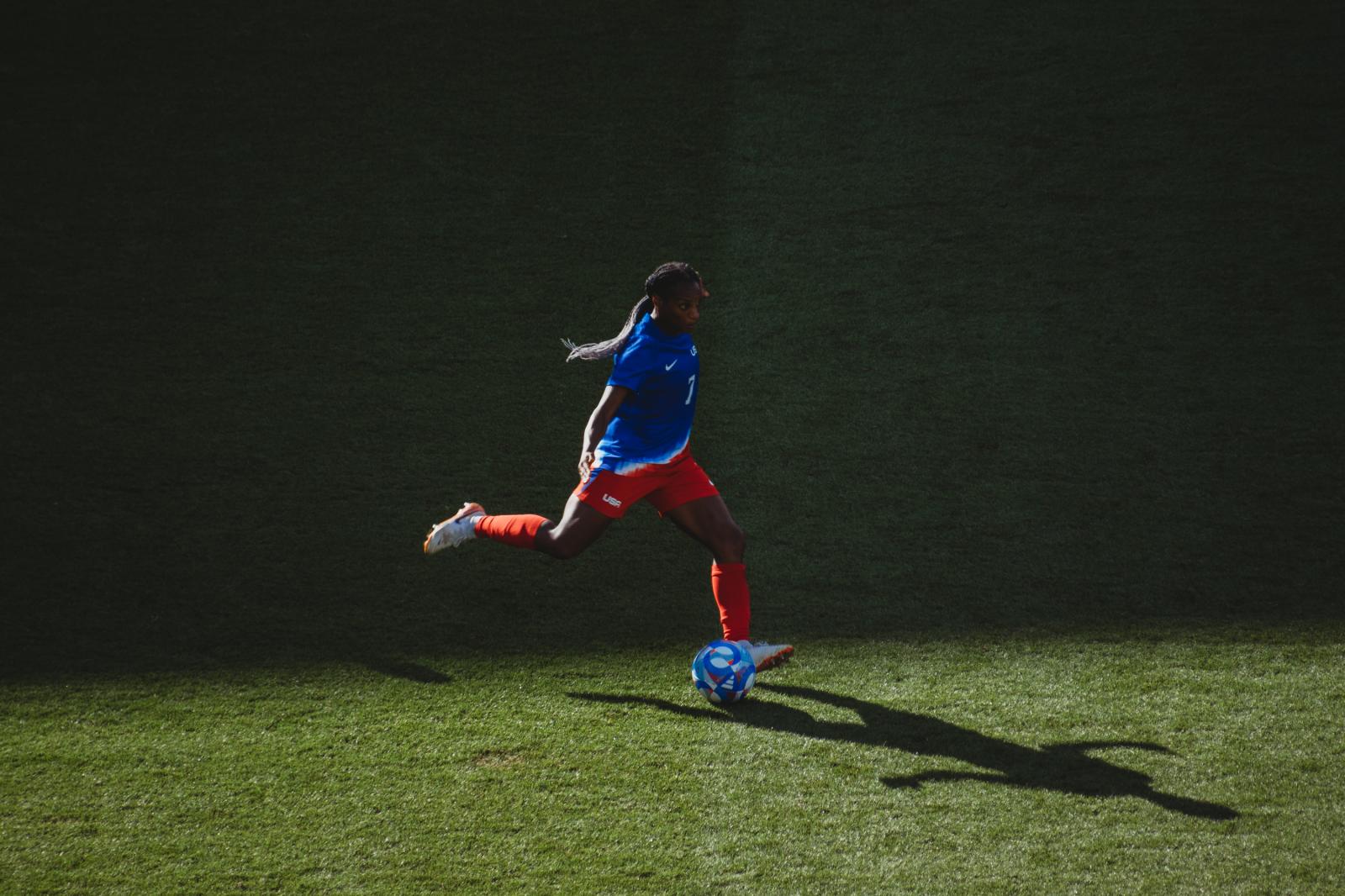 Crystal Dunn looks to pass the ...old Medal Match against Brazil.
