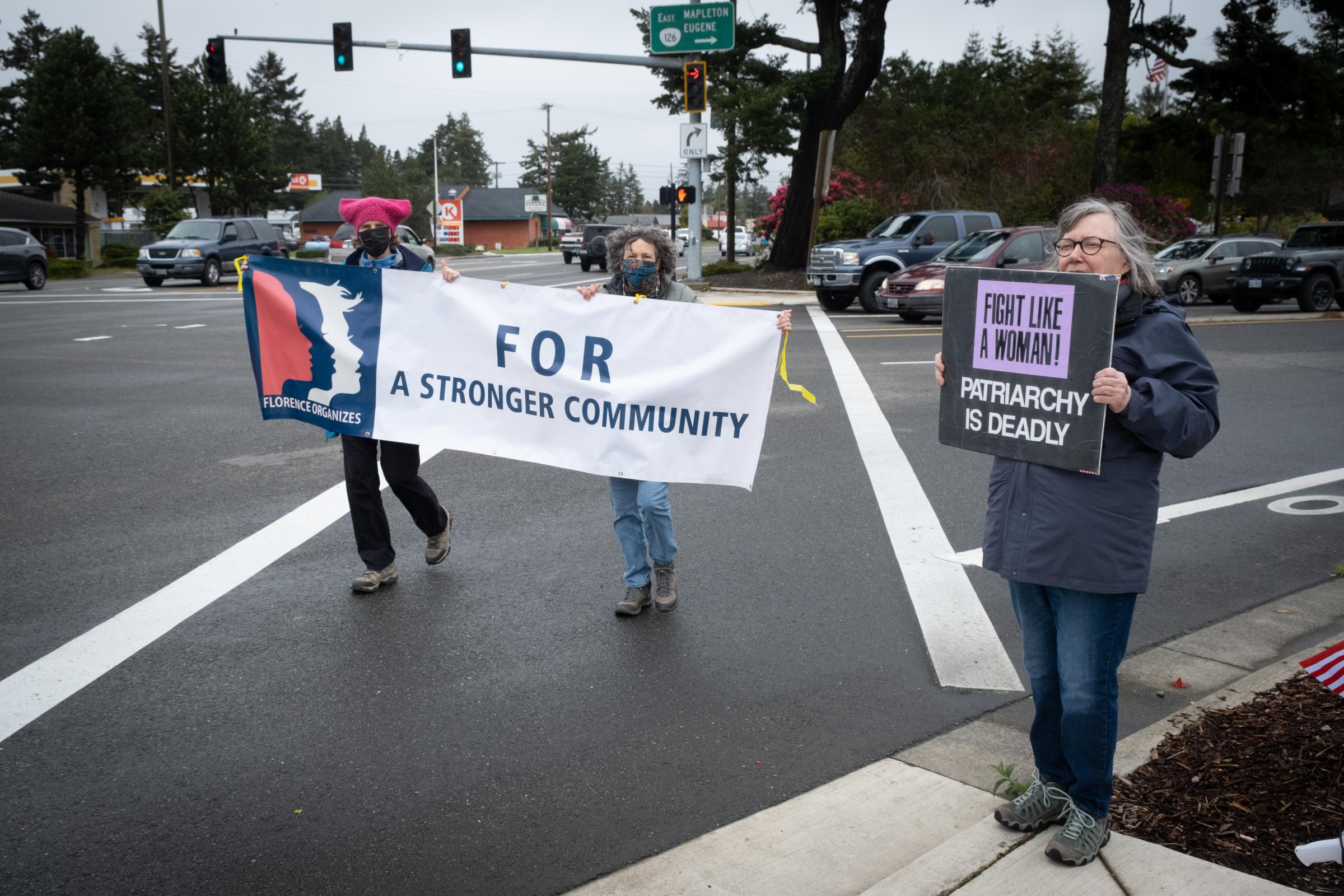 Bans Off Our Bodies Rally Florence Oregon - Women with Florence Organizes banner and women with Patriarchy is Deadly sign, Bans Off Our...