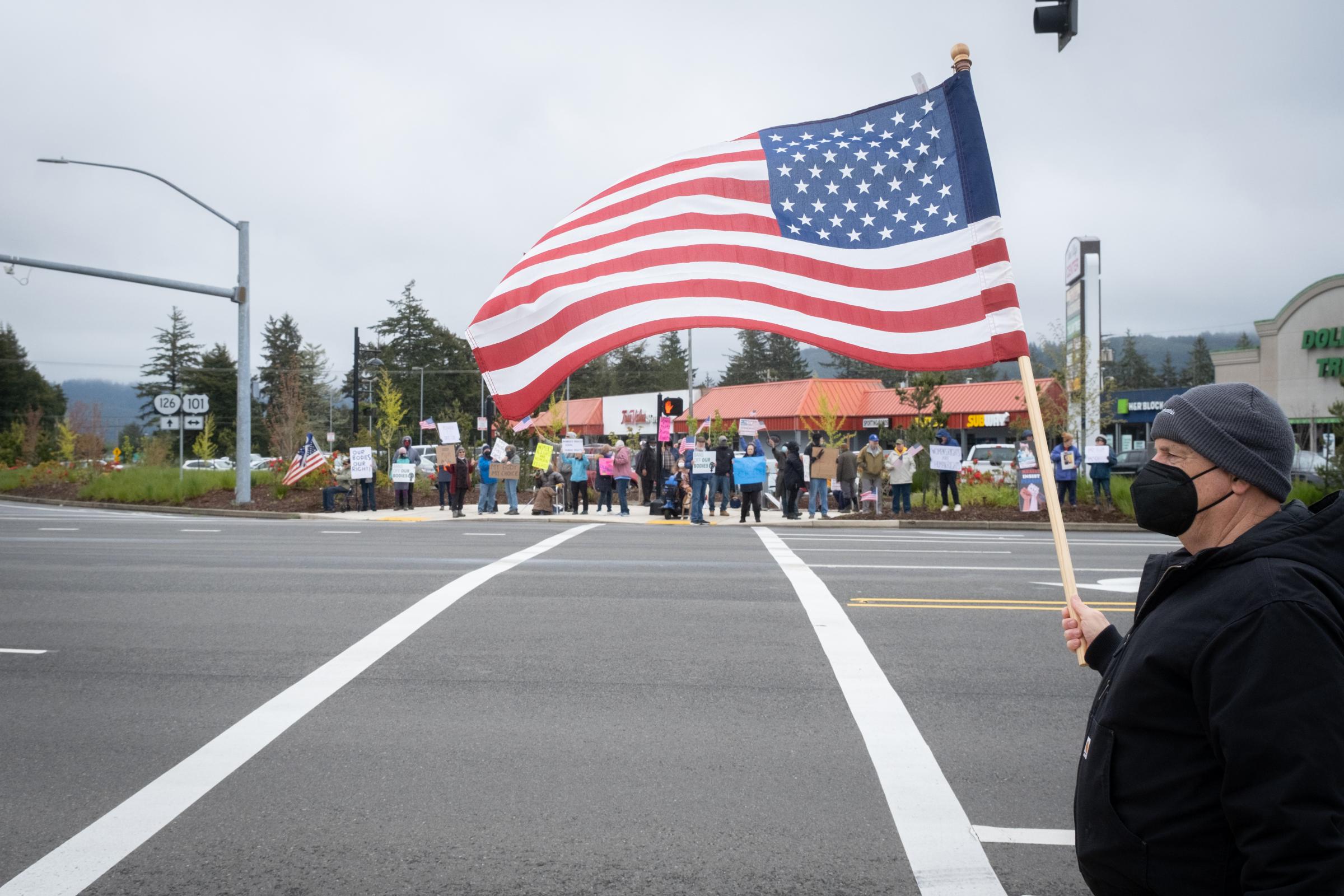 Bans Off Our Bodies Rally Florence Oregon - Man with American Flag on Highways 101 and 126, Bans Off Our Bodies protest, Florence Oregon, May...