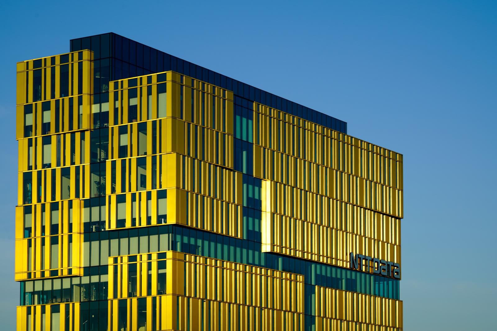  Milan, Italy  # 3915 5/2023 The golden shimmering office building of the IT company NTTdata, part of the Architectural project "The Sign" by architect Progetto CMR.