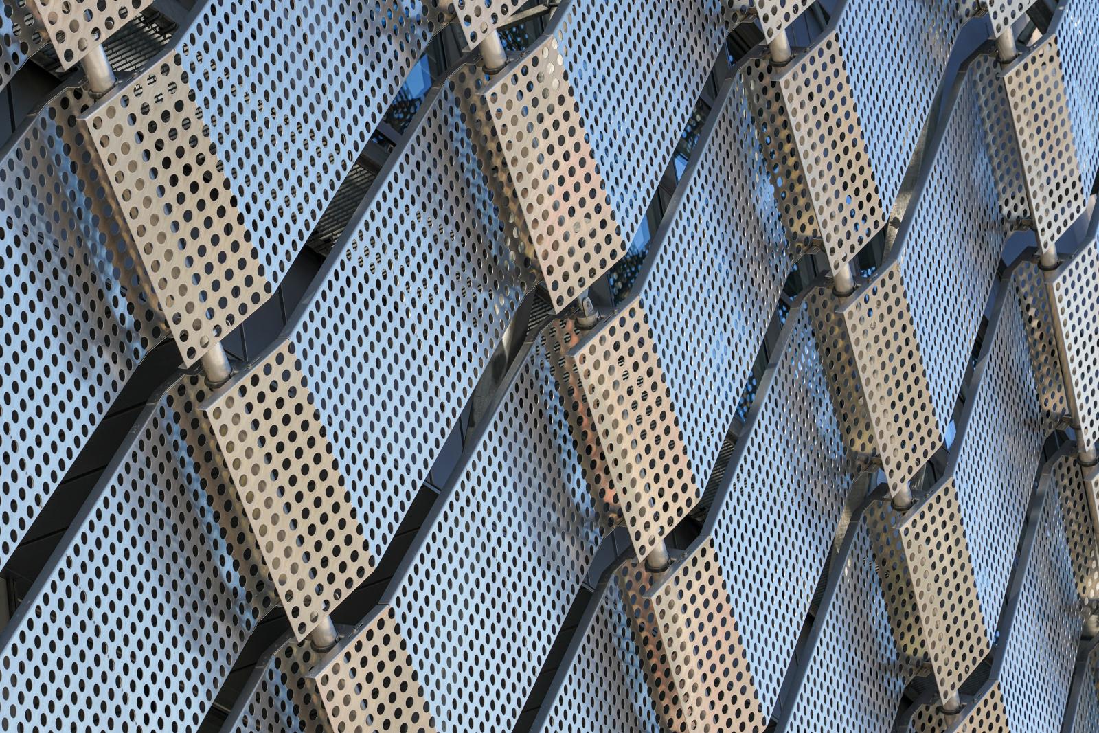 Patterned Precision: Rows of perforated Metal Panels