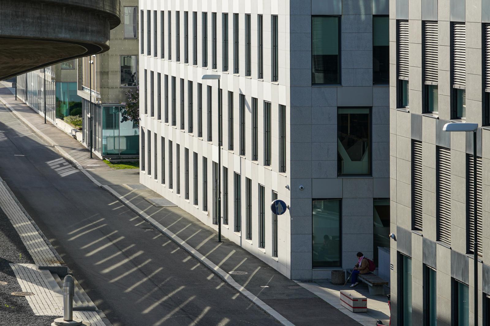 Shadows Between the Concrete Veins: A Woman in Oslo absorbed in her own World