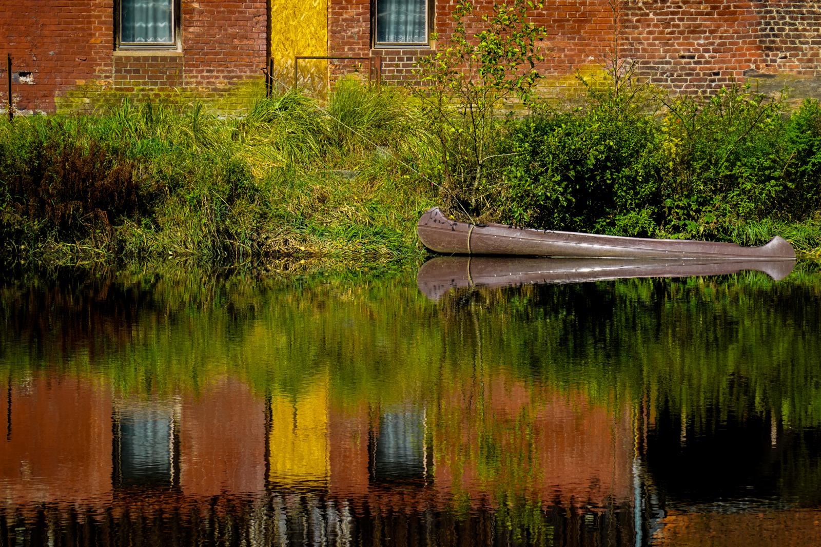 By the Schwarzer Regen River in Teisnach: A Canoe rests quietly  | Buy this image