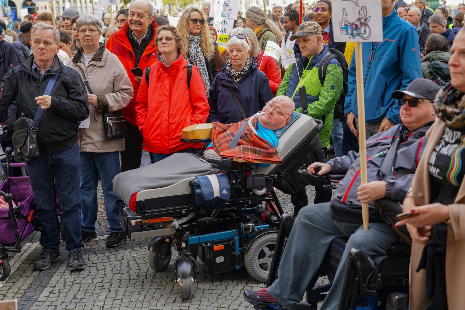  A very disabled man in a wheel...ty and equality within society.