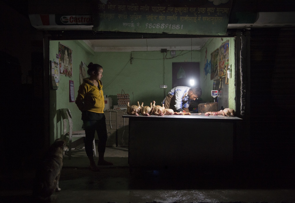  A rare view, this butcher in K...rking late hours in his shop.Â 