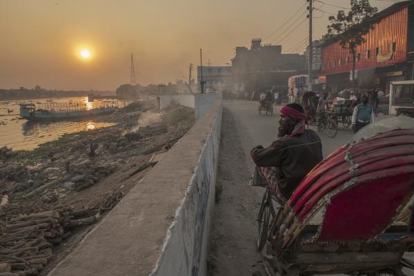 Dangerous job of recycling - A rickshaw driver, the most common means of transportation in Bangladesh, watches the sun set...