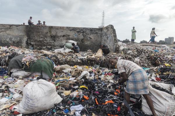 Dangerous job of recycling - A group of people rummage in the waste of an open dump in Old Dhaka, a neighborhood in the...