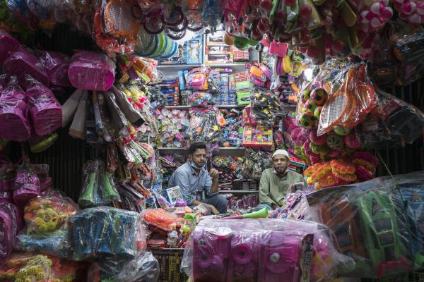 Dangerous job of recycling - A couple of men sit in their toy store in Old Dhaka, very close to where they recycle the...