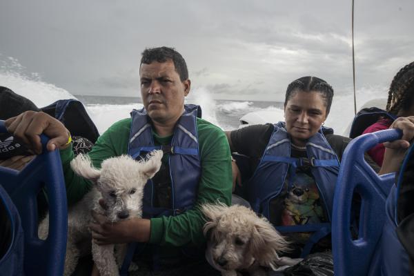 The journey trough Darien Gap - A family of Venezuelan migrants crosses the Gulf of Urab&aacute; aboard a boat, this is the...