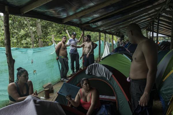 The journey trough Darien Gap - Migrant families rest in the Las Tecas camp before beginning the journey through the...