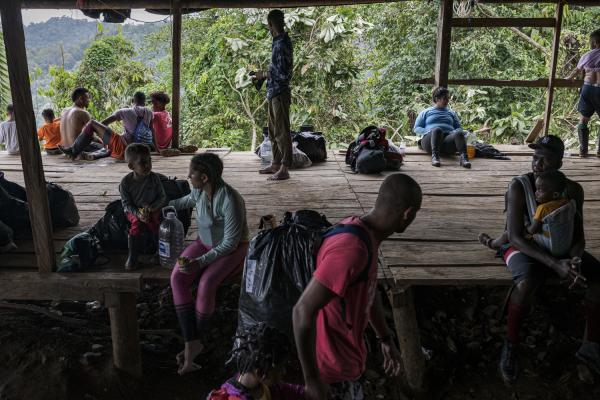 The journey trough Darien Gap - After a long eight-hour walk, a group of migrants rests in one of the few refuges in the...
