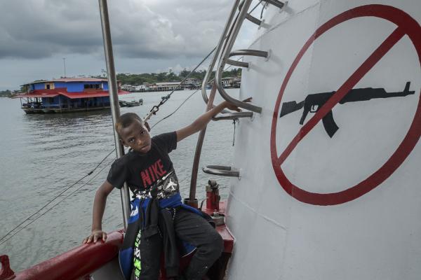 Between conflict and water, the hospital ship of the Pacific Region of Colombia - A little boy from the community of Puerto Saija waits for his mother on the deck of the ship, she...