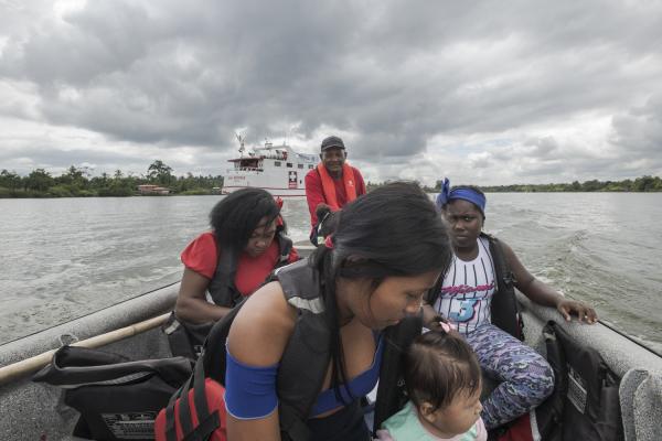 Between conflict and water, the hospital ship of the Pacific Region of Colombia - Three women are being transported in a boat to the community of Puerto Saija, Colombia. These...