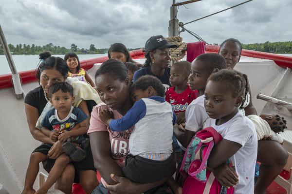 Between conflict and water, the hospital ship of the Pacific Region of Colombia - A group of women and children wait on the deck of the San Raffaele hospital ship to receive...