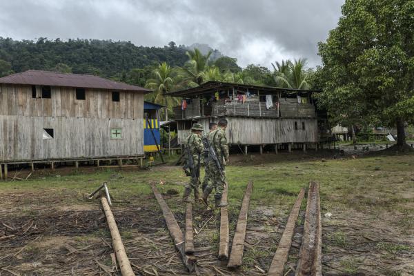 The violated territory, the isolation of the communities in Medio Atrato, Colombia - Colombian army soldiers walk through the streets of the community of Chan&uacute;. Due to the...