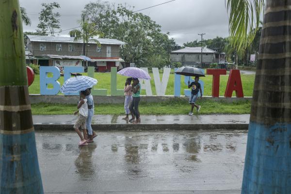 The violated territory, the isolation of the communities in Medio Atrato, Colombia - Inhabitants of the town of Bellavista walk in the rain. Bellavista is a relatively new...