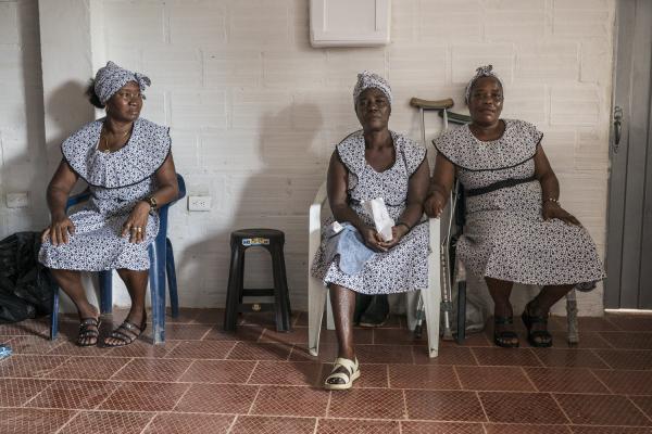 The violated territory, the isolation of the communities in Medio Atrato, Colombia - Ana Oneida Orejuela, Rosmira, and Rosa Pulia are sitting in a small health center in the...