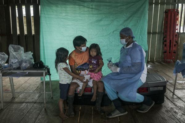 The violated territory, the isolation of the communities in Medio Atrato, Colombia - A girl from the indigenous community receives medical attention for a respiratory problem. The...