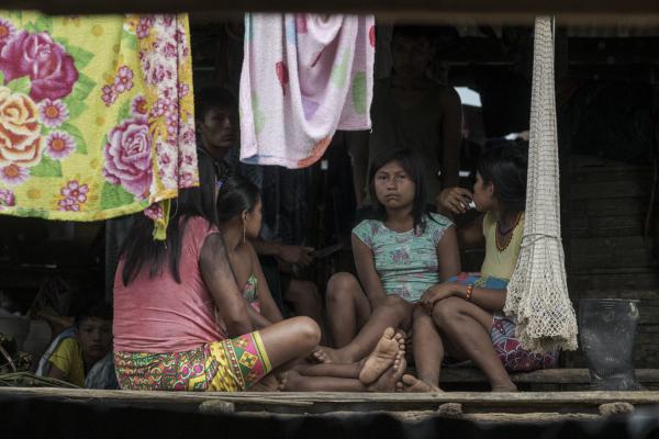 The violated territory, the isolation of the communities in Medio Atrato, Colombia - The Baquiaza family sitting in their little hut. The father of this family died in February 2021...