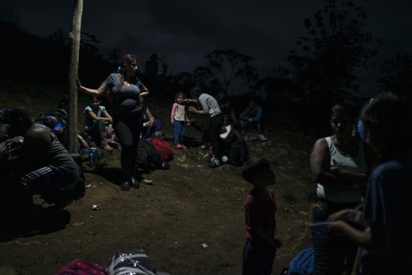 The tortuous journey, the migration through America - Different groups prepare at dawn at the Las Tecas camp to begin their trek through the Darien...