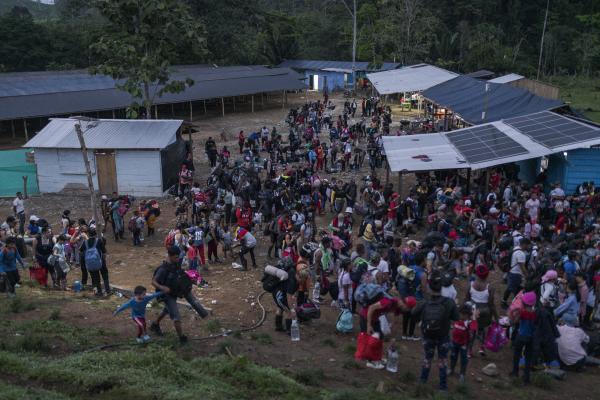 The tortuous journey, the migration through America - Hundreds of migrants prepare at dawn in the Las Tecas camp, Acandí, to begin their journey into...