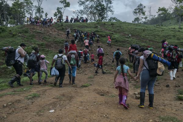 The tortuous journey, the migration through America - Dozens of migrants of different nationalities walk through the Colombian Darien Jungle. In the...