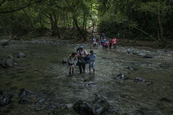 The tortuous journey, the migration through America - A family of Chinese origin crosses one of the Pinololo rivers during their journey through the...
