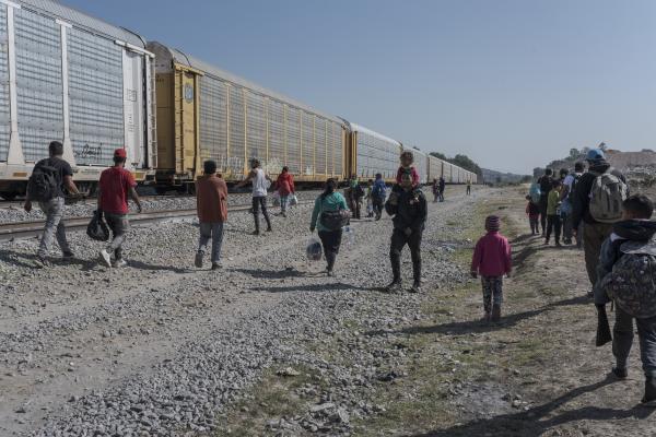 The tortuous journey, the migration through America - Dozens of families and people walk towards "La Bestia", the freight train that crosses...
