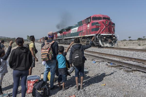 The tortuous journey, the migration through America - Several families of migrants waiting for the train to stop so they can board it and travel to the...