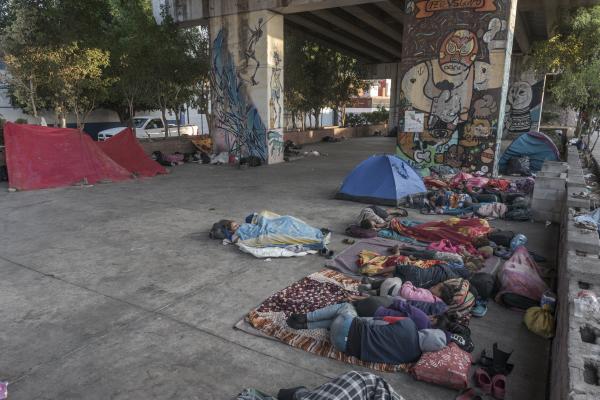 The tortuous journey, the migration through America - A group of families that are migrating to the United States of America sleep under a bridge in...