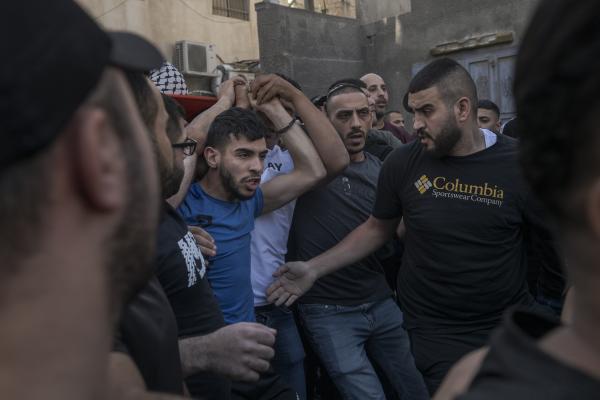 Funeral in West Bank - A group of men carry the body of Ibrahim Zayad who was shot by the Israeli army towards the...